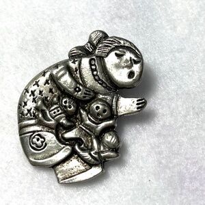 NATIVE STORYTELLER PIN BACK BROOCHE